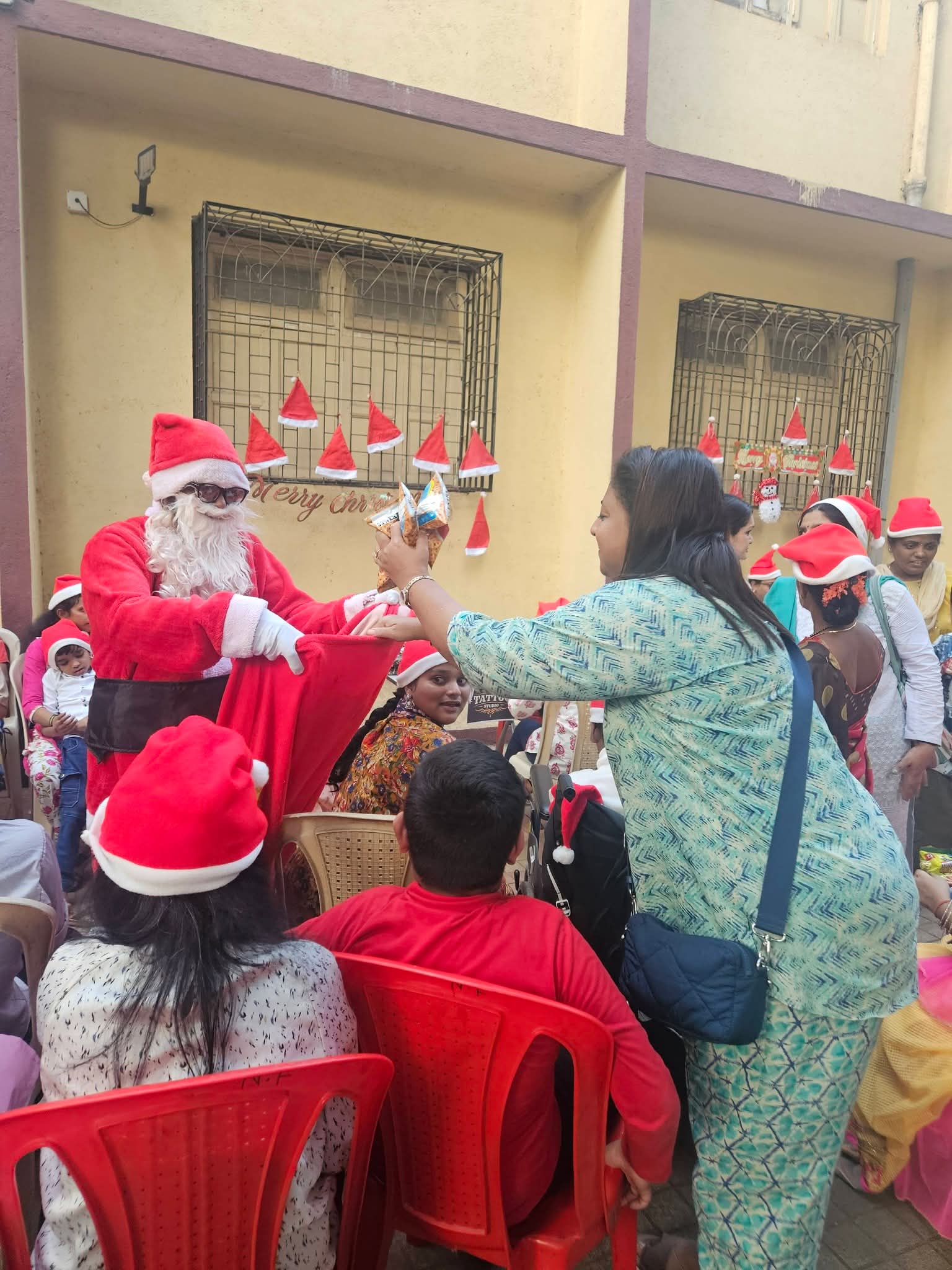 Santa distributing gifts at Kanishka Foundation